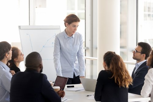 A professional woman is delivering an engaging business presentation using advanced IT consulting services